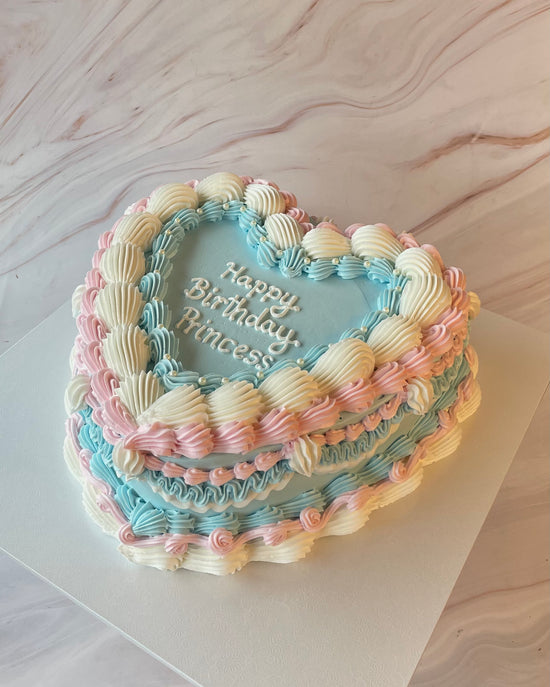 Pastel blue and pink vintage heart cake side view