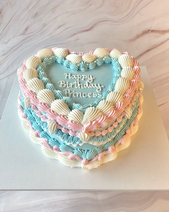 Pastel blue and pink vintage heart cake top view
